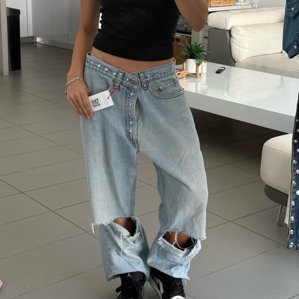 Distressed denim jeans, straight leg, blue, with a streetwear vibe handcrafted